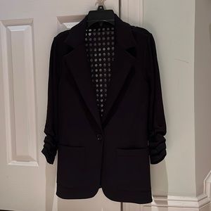Bailey 44 - Black stylish jacket with sheer dotted back panel.